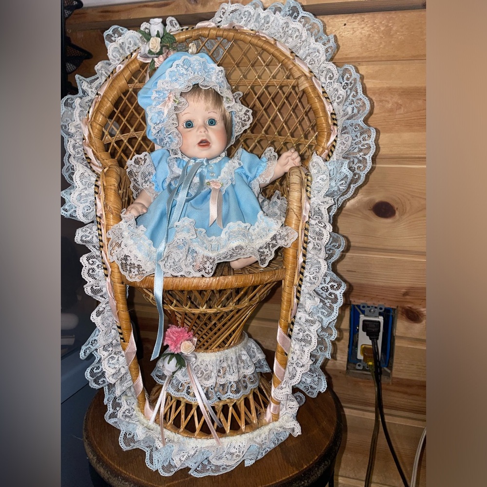 Doll with baby blue dress with lace with chair and cushion for chair